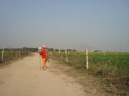 A sadhu on his way back from Pani ghat, River yamuna, Vrindavan, India