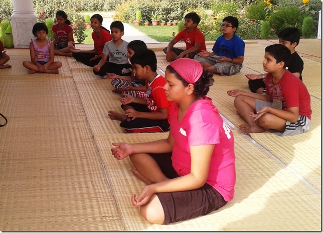 children meditating at vrindavan farm, organic india, lucknow